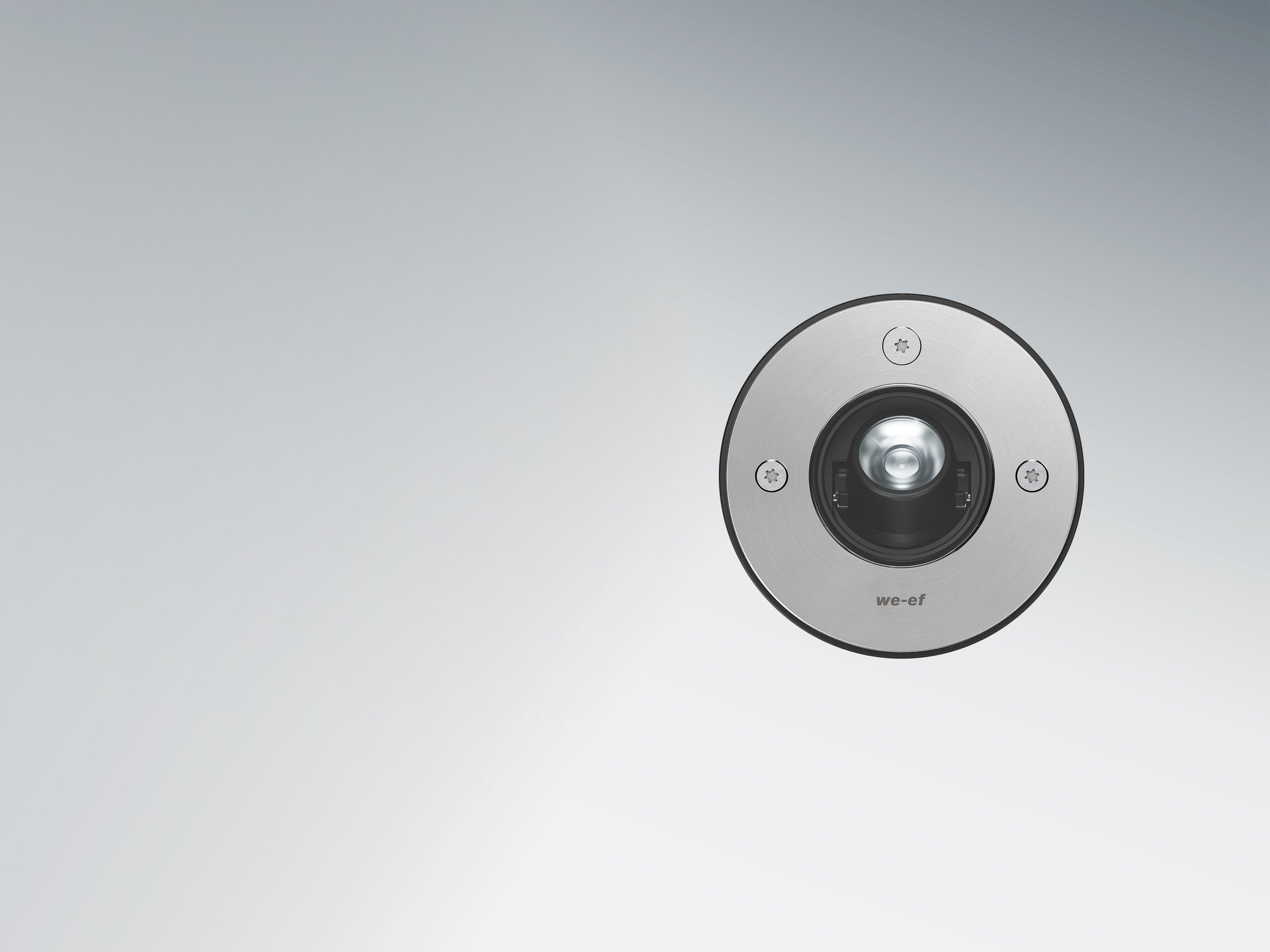 WE-EF ETC210-TB inground luminaire with precision optics and adjustable light distribution. Discreet design for accent lighting of architecture and outdoor spaces.