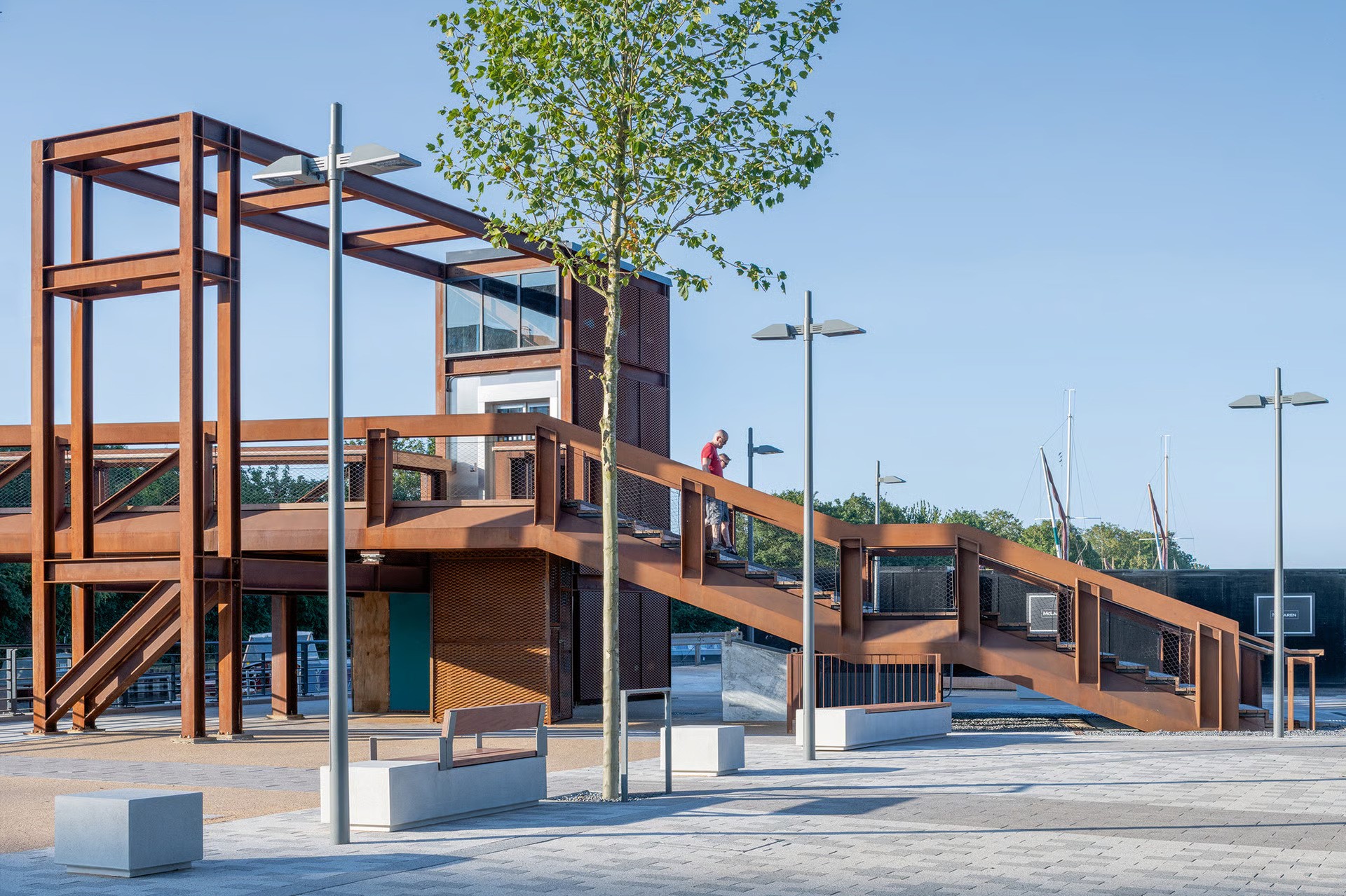 Hale Wharf pedestrian bridge crossing canal connecting Tottenham to compact mixed-use development with up to 505 apartments in final configuration, WE-EF PFL230 LED street lighting on poles with 5CE corrosion protection and timeless design ensuring long-term reliability, project developed by Muse Developments for Canal and River Trust as sustainable affordable housing near shopping centre and public transport stations