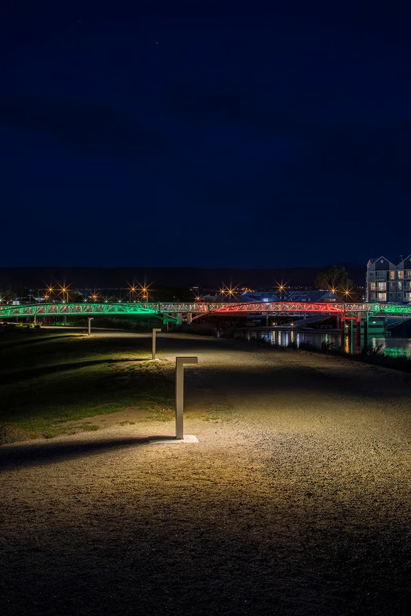 WE-EF PSY400 bollard pathway lighting illuminating pedestrian walkway at night at Riverbend Park reducing water light spill and protecting aquatic ecosystems