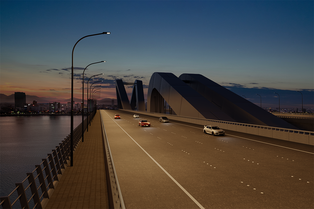 Eine Brücke mit Autos führt über einen Fluss, beleuchtet von AFL100-Leuchten. Im Hintergrund ist eine Stadtlandschaft unter einem abendlichen Himmel mit stimmungsvollem Licht zu sehen.