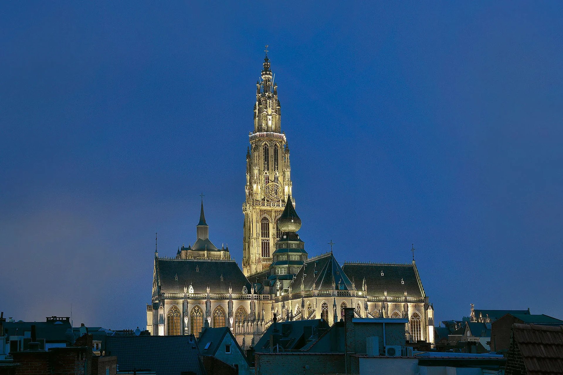 Cathedral of Our Lady Antwerp illuminated at night with WE-EF FLC230 LED projectors highlighting Gothic architecture and 123-meter spire Belgium