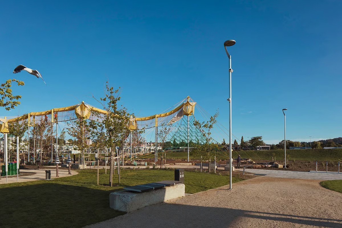 Riverbend Park Launceston recreational area showing playground zone with WE-EF pathway lighting and RMM300 luminaires under blue sky in Tasmania