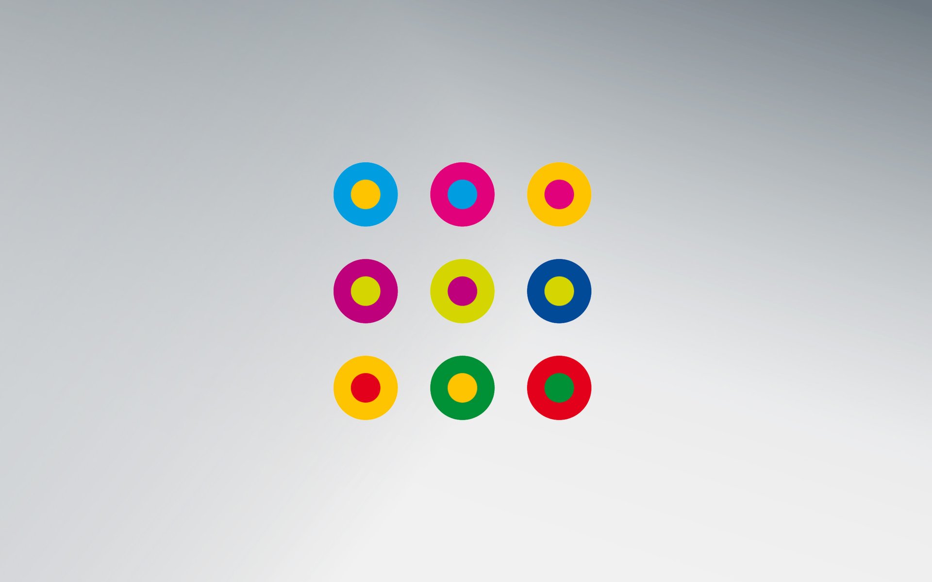 Neuf cercles concentriques colorés sur fond gris, symbole de la Charte de la diversité (Charta der Vielfalt)